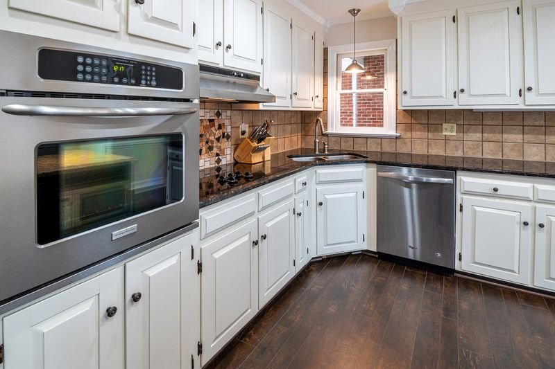 White kitchen base cabinets meeting the floor