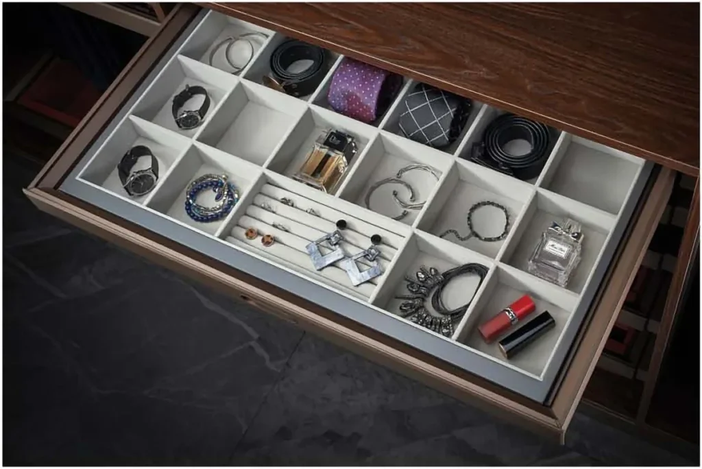 Jewellery box drawer insert with watches and rings in a wardrobe