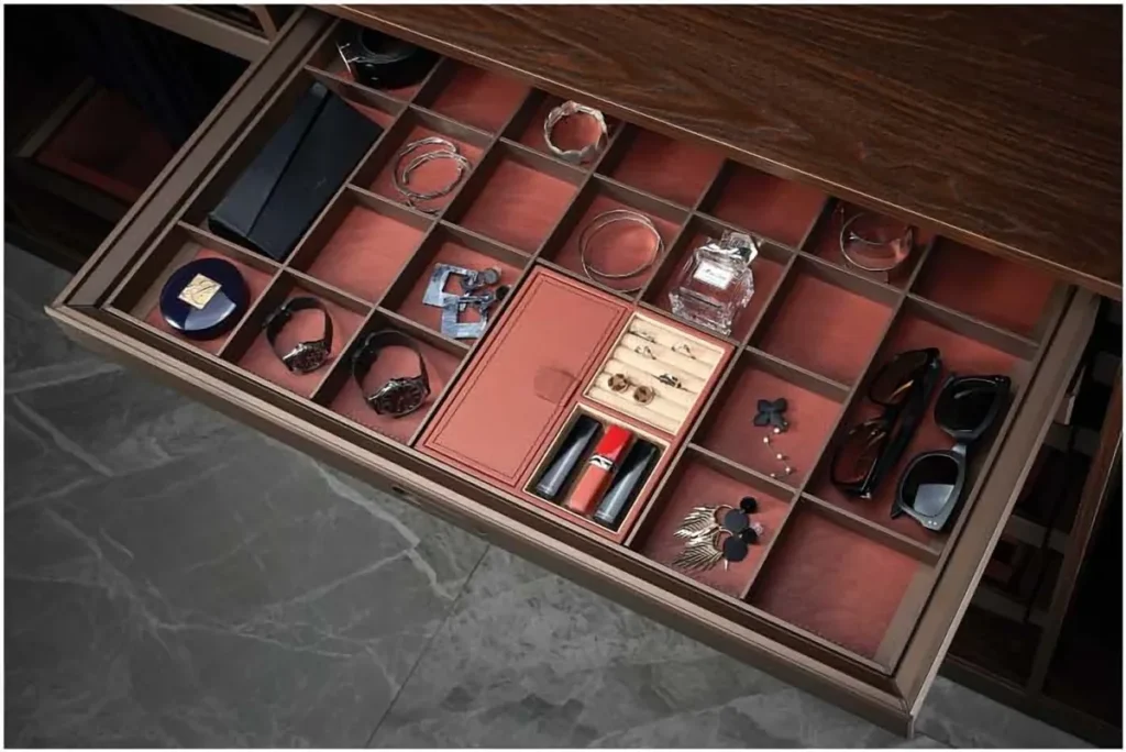 Leather wardrobe drawer organiser holding watches and accessories